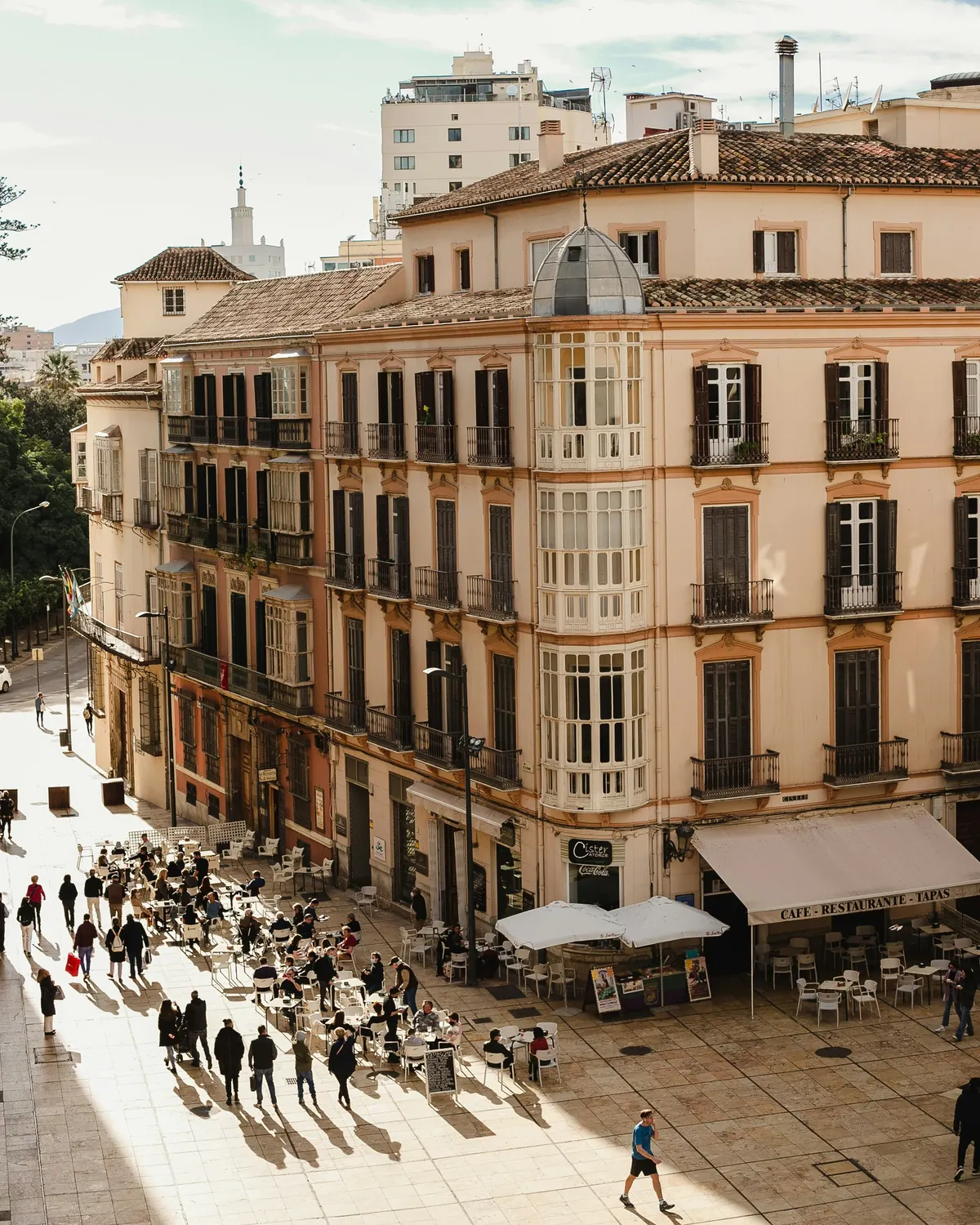 Old town Malaga square with balconies and cafes