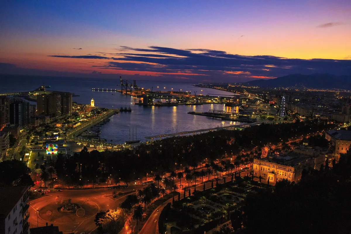 Malaga port and city lights at night