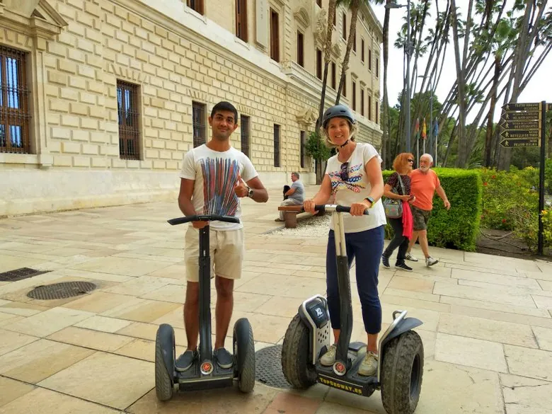 Teenagers exploring Malaga on a guided Segway activity