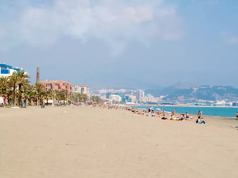 Wide sandy shoreline at Misericordia beach in Malaga